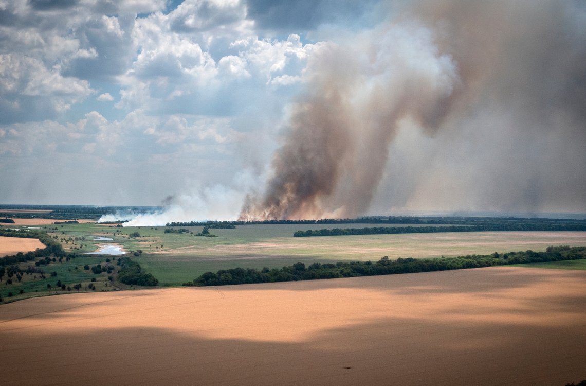 FILE - Smoke rises from the front lines where fierce battle is going between Ukrainian and Russian troops, farmer fields in the foreground, in the Dnipropetrovsk region, Ukraine, Monday, July 4, 2022. Military officials from Russia and Ukraine are set to hold a meeting in Istanbul to discuss a United Nations plan to export blocked Ukrainian grain to world markets through the Black Sea. Russia’s invasion and war disrupted production and halted shipments of Ukraine, one of the world’s largest exporters of wheat, corn and sunflower oil. (AP Photo/Efrem Lukatsky) FILE - Smoke rises from the front lines where fierce battle is going between Ukrainian and Russian troops, farmer fields in the foreground, in the Dnipropetrovsk region, Ukraine, Monday, July 4, 2022. Military officials from Russia and Ukraine are set to hold a meeting in Istanbul to discuss a United Nations plan to export blocked Ukrainian grain to world markets through the Black Sea. Russia’s invasion and war disrupted production and halted shipments of Ukraine, one of the world’s largest exporters of wheat, corn and sunflower oil. (AP Photo/Efrem Lukatsky)
