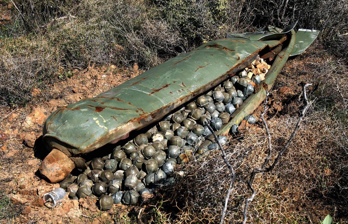 ** FILE ** In this Nov. 9, 2006 file picture, a Cluster Bomb Unit containing more than 600 cluster bombs, that was dropped by Israeli warplanes during the 34-day long Hezbollah-Israeli war, sits in a field in the southern village of Ouazaiyeh, Lebanon. International diplomats from more than 100 nations reached agreement on a treaty that would ban current designs of cluster bombs and require the destruction of stockpiles within eight years. The breakthrough Wednesday May 28, 2008 capped more than a year of negotiations that began in Norway and concluded over the past 10 days in Dublin, but Israel did not participate in the treaty. (AP Photo/Mohammed Zaatari) ** FILE ** In this Nov. 9, 2006 file picture, a Cluster Bomb Unit containing more than 600 cluster bombs, that was dropped by Israeli warplanes during the 34-day long Hezbollah-Israeli war, sits in a field in the southern village of Ouazaiyeh, Lebanon. International diplomats from more than 100 nations reached agreement on a treaty that would ban current designs of cluster bombs and require the destruction of stockpiles within eight years. The breakthrough Wednesday May 28, 2008 capped more than a year of negotiations that began in Norway and concluded over the past 10 days in Dublin, but Israel did not participate in the treaty. (AP Photo/Mohammed Zaatari)