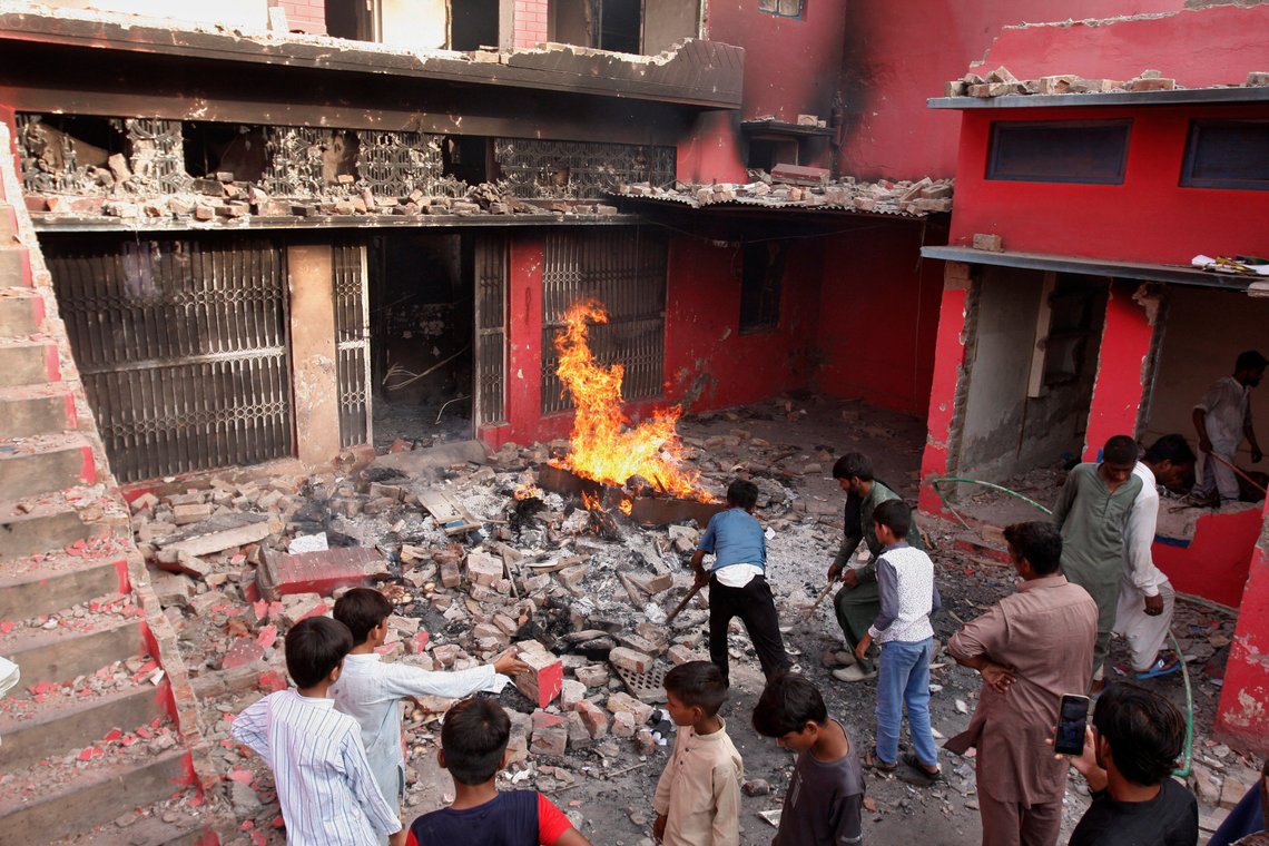 Youngsters look a church damaged and burned by angry Muslim mob in Jaranwala near Faisalabad, Pakistan, Wednesday, Aug. 16, 2023. Police say a Muslim mob has attacked a Christian area in Pakistan’s eastern Punjab province, burning a church, damaging four others and demolishing a man's house after accusing him of desecrating Islam’s holy book. (AP Photo/Muhammad Shafqat) Youngsters look a church damaged and burned by angry Muslim mob in Jaranwala near Faisalabad, Pakistan, Wednesday, Aug. 16, 2023. Police say a Muslim mob has attacked a Christian area in Pakistan’s eastern Punjab province, burning a church, damaging four others and demolishing a man's house after accusing him of desecrating Islam’s holy book. (AP Photo/Muhammad Shafqat)
