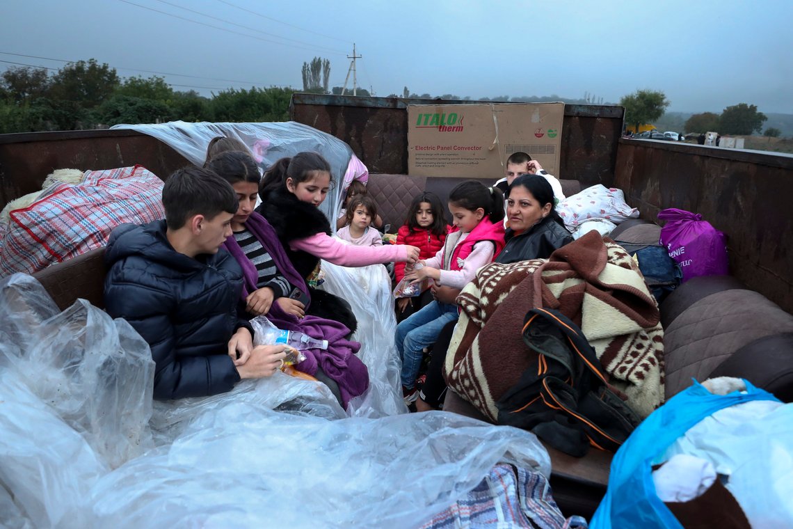 Ethnic Armenians from Nagorno-Karabakh sit in a truck on their way to Kornidzor in Syunik region, Armenia, Monday, Sept. 25, 2023. Thousands of Armenians have streamed out of Nagorno-Karabakh after the Azerbaijani military reclaimed full control of the breakaway region last week. (Stepan Poghosyan, Photolure photo via AP) Ethnic Armenians from Nagorno-Karabakh sit in a truck on their way to Kornidzor in Syunik region, Armenia, Monday, Sept. 25, 2023. Thousands of Armenians have streamed out of Nagorno-Karabakh after the Azerbaijani military reclaimed full control of the breakaway region last week. (Stepan Poghosyan, Photolure photo via AP)