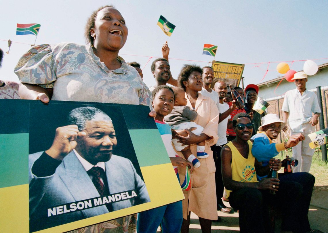 Soweto residents celebrate as President-elect Nelson Mandela was sworn in as South Africa's first black president at an inauguration ceremonies in Pretoria, May 10, 1994. (AP Photo/Joao Silva) Soweto residents celebrate as President-elect Nelson Mandela was sworn in as South Africa's first black president at an inauguration ceremonies in Pretoria, May 10, 1994. (AP Photo/Joao Silva)