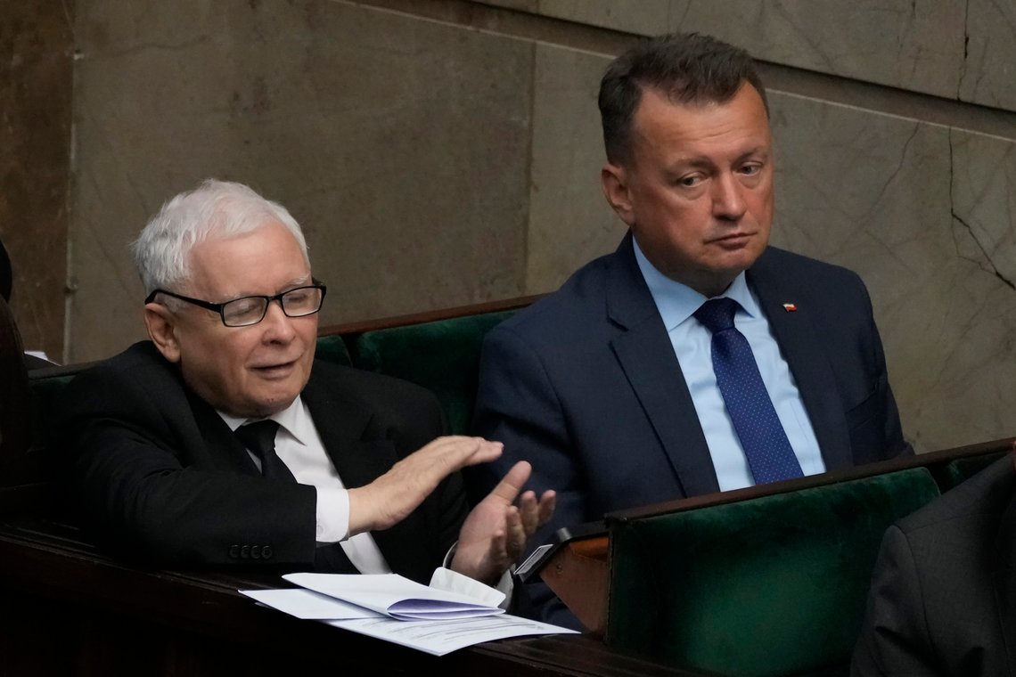 The leader of Poland's ruling party Jaroslaw Kaczynski, left, and defense minister, Mariusz Blaszczak ,right, during parliament vote to confirm that a government-planned controversial referendum on migration will be held alongside key parliamentary elections on Oct. 15, at the lower house of parliament in Warsaw, Poland, on Thursday, Aug. 17, 2023. Critics say the referendum is a campaign ploy by ruling Law and Justice party to discredit the opposition and rally voters around government politics. (AP Photo/Czarek Sokolowski) The leader of Poland's ruling party Jaroslaw Kaczynski, left, and defense minister, Mariusz Blaszczak ,right, during parliament vote to confirm that a government-planned controversial referendum on migration will be held alongside key parliamentary elections on Oct. 15, at the lower house of parliament in Warsaw, Poland, on Thursday, Aug. 17, 2023. Critics say the referendum is a campaign ploy by ruling Law and Justice party to discredit the opposition and rally voters around government politics. (AP Photo/Czarek Sokolowski)