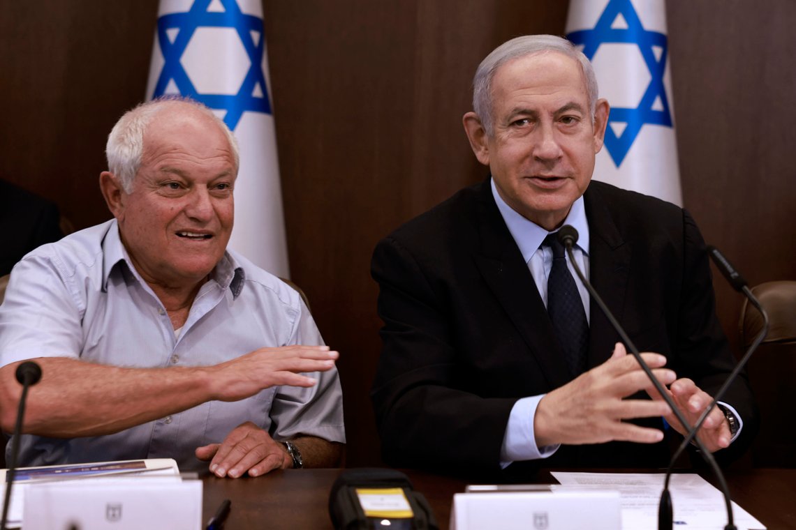Israeli Prime Minister Benjamin Netanyahu, right, chairs a weekly cabinet meeting, flanked by Tourism Minister Haim Katz, at his office in Jerusalem Sunday, Aug. 27, 2023 (Menahem Kahana/Pool Photo via AP) Israeli Prime Minister Benjamin Netanyahu, right, chairs a weekly cabinet meeting, flanked by Tourism Minister Haim Katz, at his office in Jerusalem Sunday, Aug. 27, 2023 (Menahem Kahana/Pool Photo via AP)