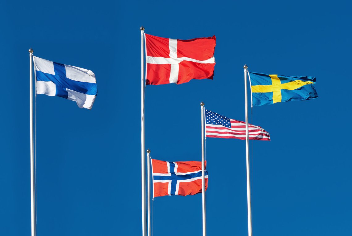 Scandinavian and The United States Flag on blue sky background. Photo: Shutterstock by Stefan Holm, Sweden. (Scandinavian countries are not the USA's #1 fan, Journ. anm.) Scandinavian and The United States Flag on blue sky background. Photo: Shutterstock by Stefan Holm, Sweden. (Scandinavian countries are not the USA's #1 fan, Journ. anm.)