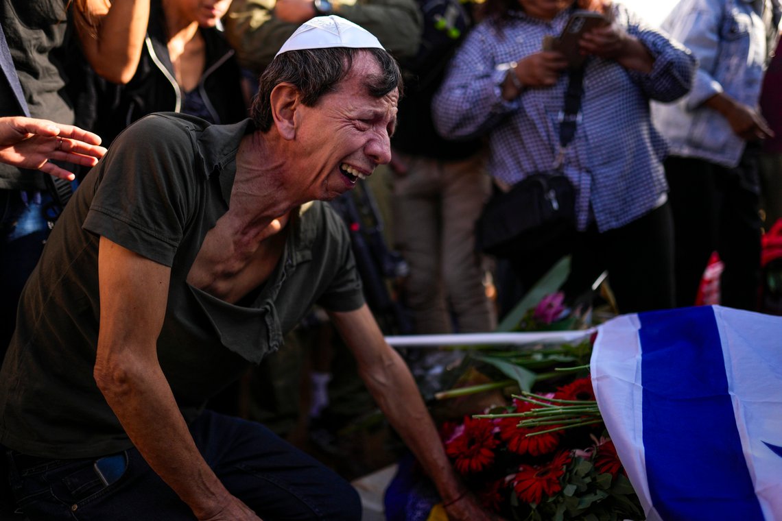 A man mourns during the funeral of Antonio Macias, killed by Hamas militants, while attending a music festival in southern Israel, at Pardes Haim cemetery in Kfar Saba, Israel, Sunday, Oct. 15, 2023. (AP Photo/Francisco Seco) A man mourns during the funeral of Antonio Macias, killed by Hamas militants, while attending a music festival in southern Israel, at Pardes Haim cemetery in Kfar Saba, Israel, Sunday, Oct. 15, 2023. (AP Photo/Francisco Seco)