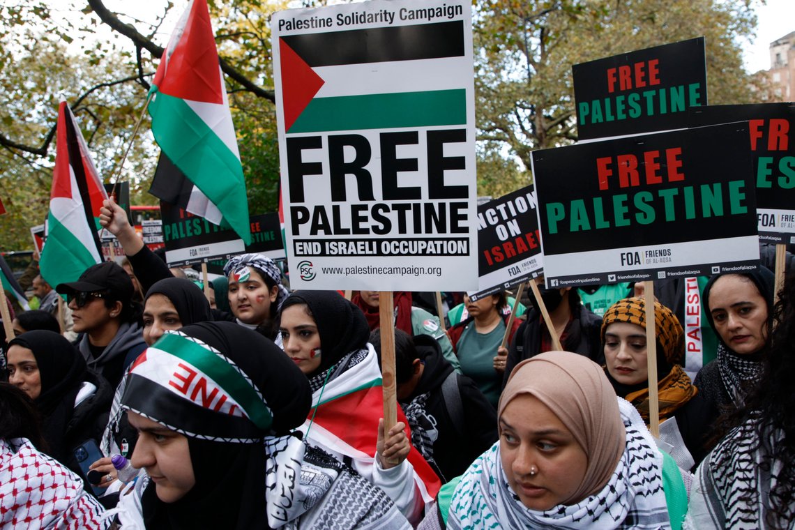 Demonstrators hold up flags and placards during a pro Palestinian demonstration in London, Saturday, Oct. 21, 2023. (AP Photo/David Cliff) Demonstrators hold up flags and placards during a pro Palestinian demonstration in London, Saturday, Oct. 21, 2023. (AP Photo/David Cliff)