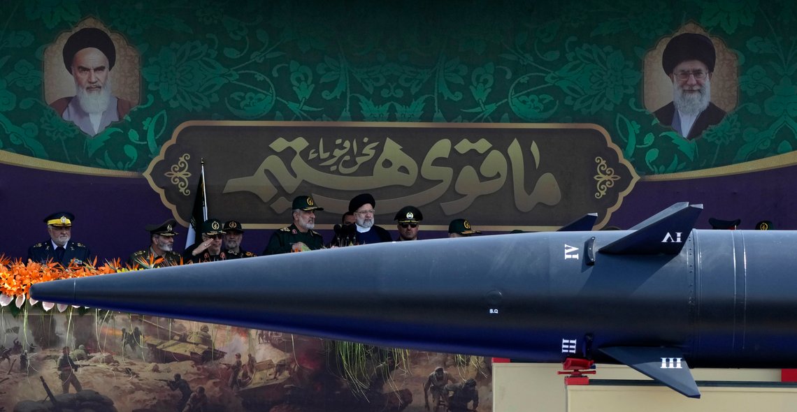 Iranian President Ebrahim Raisi, wearing black turban at center, listens to the Revolutionary Guard aerospace division commander Gen. Amir Ali Hajizadeh as he reviews an annual military parade marking anniversary of the beginning of war against Iran by former Iraqi Dictator Saddam Hussein, in front of the shrine of the late revolutionary founder Ayatollah Khomeini, just outside Tehran, Iran, Friday, Sept. 22, 2023. Portraits of the late revolutionary founder Ayatollah Khomeini, left, and Supreme Leader Ayatollah Ali Khamenei, right, are seen. (AP Photo/Vahid Salemi) Iranian President Ebrahim Raisi, wearing black turban at center, listens to the Revolutionary Guard aerospace division commander Gen. Amir Ali Hajizadeh as he reviews an annual military parade marking anniversary of the beginning of war against Iran by former Iraqi Dictator Saddam Hussein, in front of the shrine of the late revolutionary founder Ayatollah Khomeini, just outside Tehran, Iran, Friday, Sept. 22, 2023. Portraits of the late revolutionary founder Ayatollah Khomeini, left, and Supreme Leader Ayatollah Ali Khamenei, right, are seen. (AP Photo/Vahid Salemi)