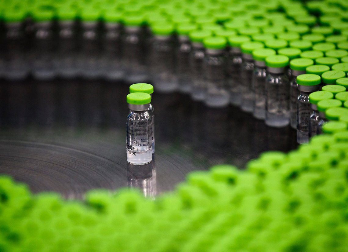 CORRECTS TYPE OF VACCINE TO H5N1 INSTEAD OF H1N1 - In this photo taken on Thursday, Nov. 24, 2011, vials of H5N1 flu vaccine by Beijing-based drug maker Sinovac Biotech Ltd. are seen during production at Sinovac facilities in Beijing. The world should get ready for a new Made in China product, vaccines. After years of supplying its own market, China's vaccine makers are gearing up to push exports in a move that should lower costs of lifesaving immunizations for the world's poor and provide major new competition for the big Western pharmaceutical companies. (AP Photo/Andy Wong) CORRECTS TYPE OF VACCINE TO H5N1 INSTEAD OF H1N1 - In this photo taken on Thursday, Nov. 24, 2011, vials of H5N1 flu vaccine by Beijing-based drug maker Sinovac Biotech Ltd. are seen during production at Sinovac facilities in Beijing. The world should get ready for a new Made in China product, vaccines. After years of supplying its own market, China's vaccine makers are gearing up to push exports in a move that should lower costs of lifesaving immunizations for the world's poor and provide major new competition for the big Western pharmaceutical companies. (AP Photo/Andy Wong)