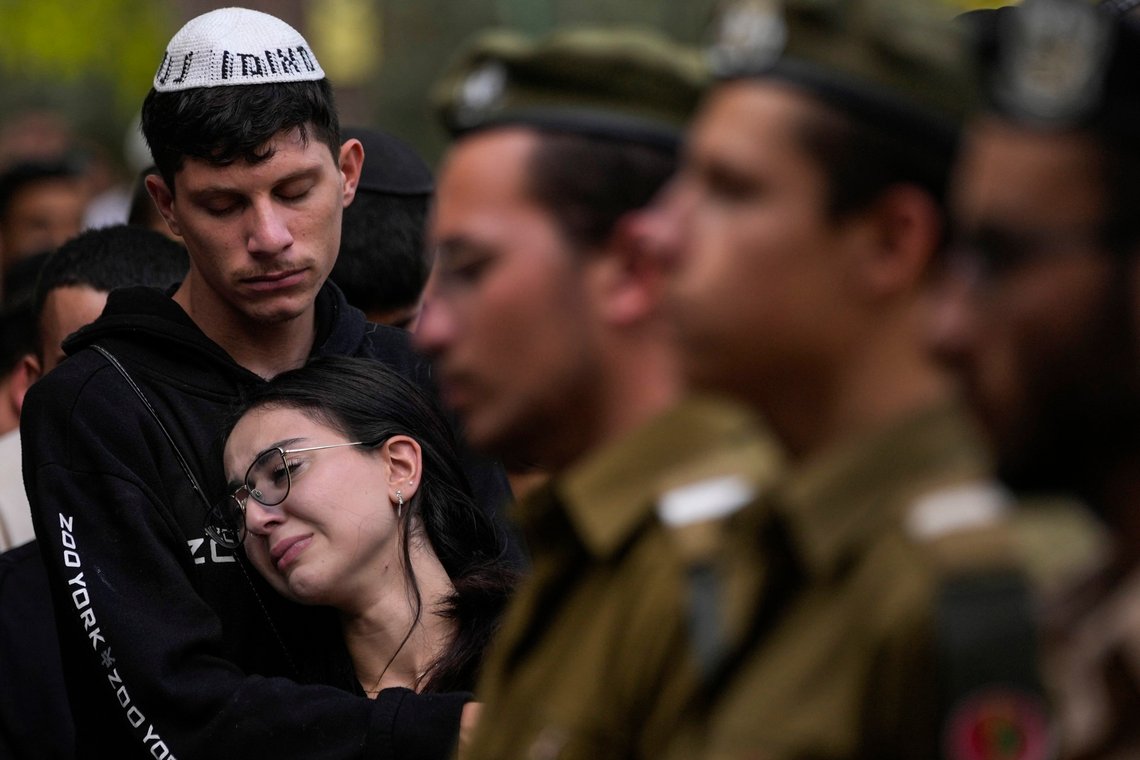 Mourners attend the funeral of Israeli soldier Abraham Cohen at the Mount Herzl cemetery in Jerusalem, Thursday, Oct. 12, 2023. (AP Photo/Francisco Seco) Mourners attend the funeral of Israeli soldier Abraham Cohen at the Mount Herzl cemetery in Jerusalem, Thursday, Oct. 12, 2023. (AP Photo/Francisco Seco)
