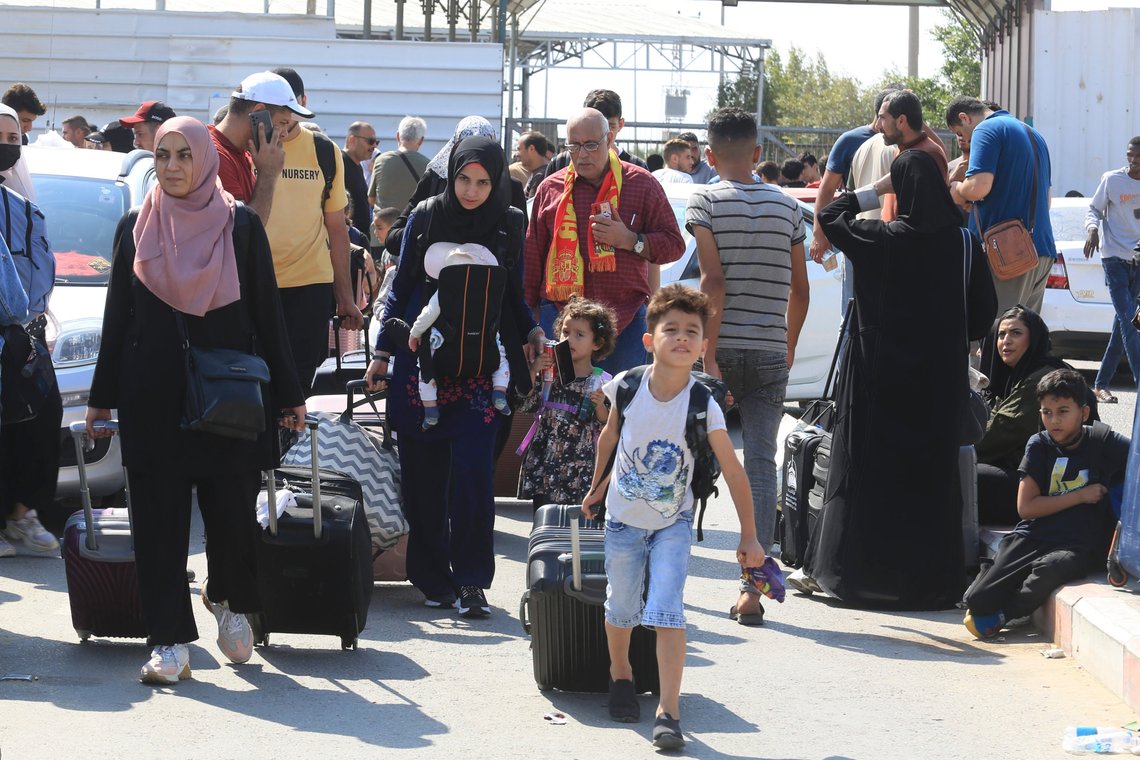 Palestinians wait at the Rafah border crossing between the Gaza Strip and Egypt Gaza Strip on Saturday, Oct. 14, 2023. Israel carried out some limited ground operations ahead of an expected broader land offensive against Gaza's militant Hamas rulers following their attack into southern Israel a week ago. (AP Photo/Hatem Ali) Palestinians wait at the Rafah border crossing between the Gaza Strip and Egypt Gaza Strip on Saturday, Oct. 14, 2023. Israel carried out some limited ground operations ahead of an expected broader land offensive against Gaza's militant Hamas rulers following their attack into southern Israel a week ago. (AP Photo/Hatem Ali)