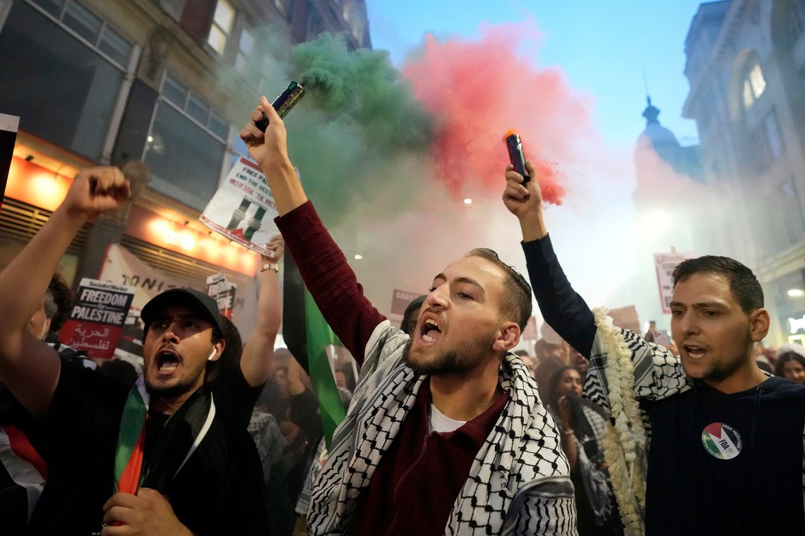Protesters hold flares during a pro Palestinian demonstration in London, Monday, Oct. 9, 2023 two days after Hamas fighters launched an unprecedented, multi-front attack on Israel which killed more than 700 people. The militants blew through a fortified border fence and gunned down civilians and soldiers in Israeli communities along the Gaza frontier during a Jewish holiday. (AP Photo/Kirsty Wigglesworth) Protesters hold flares during a pro Palestinian demonstration in London, Monday, Oct. 9, 2023 two days after Hamas fighters launched an unprecedented, multi-front attack on Israel which killed more than 700 people. The militants blew through a fortified border fence and gunned down civilians and soldiers in Israeli communities along the Gaza frontier during a Jewish holiday. (AP Photo/Kirsty Wigglesworth)