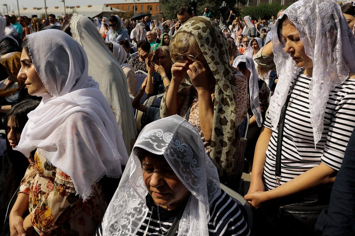 Armenian parishioners attend a national day of prayer for Artsakh (Nagorno-Karabakh) leading by Armenian Catholicos Karekin II at the Armenian Apostolic Cathedral in Etchmiadzin, the seat of the Oriental Orthodox church outside in Yerevan, Armenia, Sunday, Oct. 1, 2023. Armenia's government says an ethnic Armenian exodus has nearly emptied Nagorno-Karabakh of residents since Azerbaijan attacked and ordered the breakaway region's militants to disarm. (AP Photo/Vasily Krestyaninov) Armenian parishioners attend a national day of prayer for Artsakh (Nagorno-Karabakh) leading by Armenian Catholicos Karekin II at the Armenian Apostolic Cathedral in Etchmiadzin, the seat of the Oriental Orthodox church outside in Yerevan, Armenia, Sunday, Oct. 1, 2023. Armenia's government says an ethnic Armenian exodus has nearly emptied Nagorno-Karabakh of residents since Azerbaijan attacked and ordered the breakaway region's militants to disarm. (AP Photo/Vasily Krestyaninov)