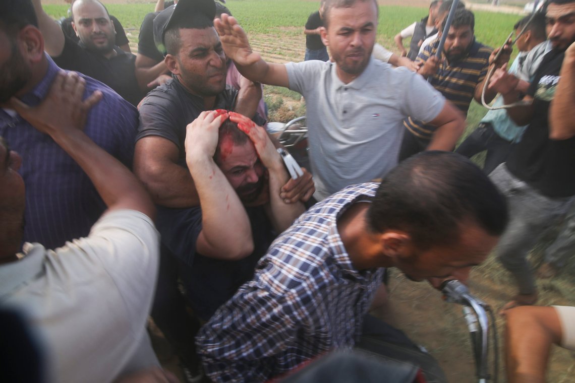 FILE - Palestinians transport a captured Israeli civilian, center, from Kibbutz Kfar Azza into the Gaza Strip on Saturday, Oct. 7, 2023. Israel's military brought together a group of foreign correspondents Monday, Oct. 16, to screen a 40-minute reel of gruesome footage compiled from the Hamas attack last week. The screening came as Israel's military faces increasing pressure to back up their claims of atrocities committed by the militants. (AP Photo/Hatem Ali, File) FILE - Palestinians transport a captured Israeli civilian, center, from Kibbutz Kfar Azza into the Gaza Strip on Saturday, Oct. 7, 2023. Israel's military brought together a group of foreign correspondents Monday, Oct. 16, to screen a 40-minute reel of gruesome footage compiled from the Hamas attack last week. The screening came as Israel's military faces increasing pressure to back up their claims of atrocities committed by the militants. (AP Photo/Hatem Ali, File)