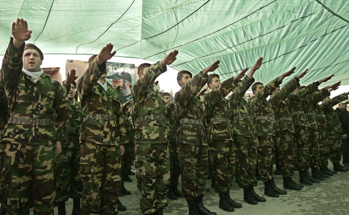 Hizbollah militants raise their arms in salute of assassinated Hezbollah top commander Imad Mughniyeh during a memorial service in his home village of Tair Debba, south Lebanon, Sunday, Feb. 17, 2008. (AP Photo/Tara Todras-Whitehill) Hizbollah militants raise their arms in salute of assassinated Hezbollah top commander Imad Mughniyeh during a memorial service in his home village of Tair Debba, south Lebanon, Sunday, Feb. 17, 2008. (AP Photo/Tara Todras-Whitehill)