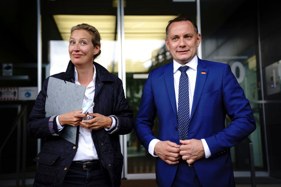FILE - Tino Chrupalla, right, co-leader of the 'Alternative For Germany' (AfD) party, and Alice Weidel, left, the party's second co-leader, are pictured after a news conference in Berlin Tuesday, May 25, 2021 .The prosecution office of the city of Ingolstadt has launched an investigation against “unknown persons” who allegedly assaulted Tino Chrupalla, one of the leaders of the German far-right Alternative for Germany party. (Kay Nietfeld/dpa via AP, File) FILE - Tino Chrupalla, right, co-leader of the 'Alternative For Germany' (AfD) party, and Alice Weidel, left, the party's second co-leader, are pictured after a news conference in Berlin Tuesday, May 25, 2021 .The prosecution office of the city of Ingolstadt has launched an investigation against “unknown persons” who allegedly assaulted Tino Chrupalla, one of the leaders of the German far-right Alternative for Germany party. (Kay Nietfeld/dpa via AP, File)