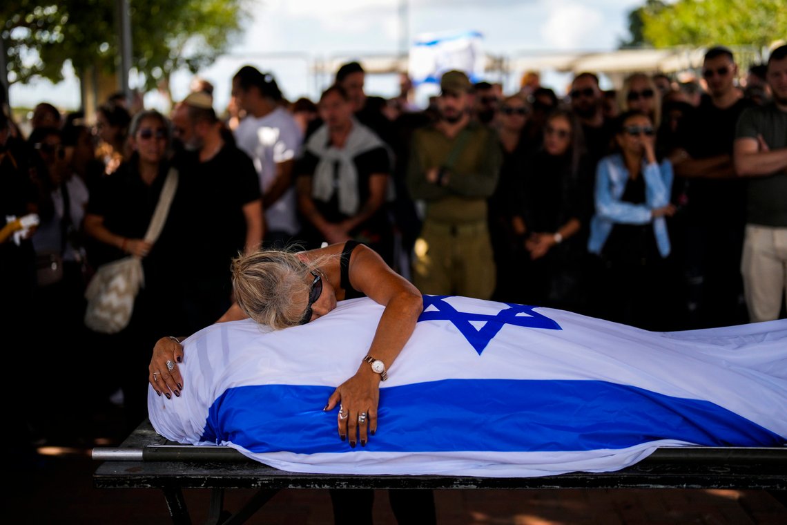 Antonio Macías' mother cries over her son's body covered with the Israeli flag at Pardes Haim cemetery in Kfar Saba, near Tel Aviv, Israel, Sunday, Oct. 15, 2023. Macias was killed by Hamas militants while attending a music festival in southern Israel earlier this month. (AP Photo/Francisco Seco) Antonio Macías' mother cries over her son's body covered with the Israeli flag at Pardes Haim cemetery in Kfar Saba, near Tel Aviv, Israel, Sunday, Oct. 15, 2023. Macias was killed by Hamas militants while attending a music festival in southern Israel earlier this month. (AP Photo/Francisco Seco)
