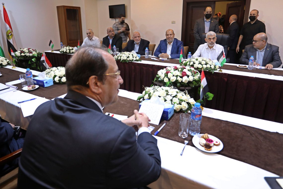 Yehiyeh Sinwar, second from right sitting at rear, the top Hamas leader in Gaza, and the head of the Egyptian General Intelligence Abbas Kamel, foreground, meet in Gaza City, Monday, May 31, 2021. (AP Photo/Ashraf Amra, Pool) Yehiyeh Sinwar, second from right sitting at rear, the top Hamas leader in Gaza, and the head of the Egyptian General Intelligence Abbas Kamel, foreground, meet in Gaza City, Monday, May 31, 2021. (AP Photo/Ashraf Amra, Pool)