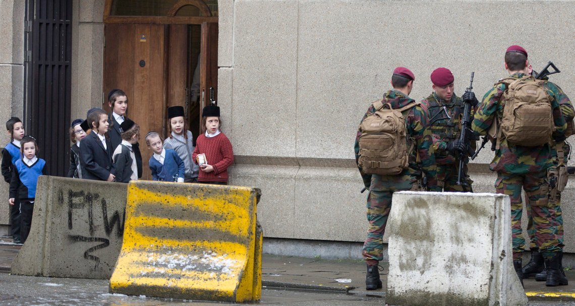 FILE - In this Saturday, Jan. 24, 2015 file photo, young Jewish children look at Belgian soldiers as they patrol during religious services in Antwerp, Belgium. The European Union unveiled Tuesday, Oct. 5, 2021 a new strategy to combat growing antisemitism in Europe with plans to better tackle hate speech, raise awareness about Jewish life, protect places of worship and ensure that the Holocaust is not forgotten. (AP Photo/Virginia Mayo, File) FILE - In this Saturday, Jan. 24, 2015 file photo, young Jewish children look at Belgian soldiers as they patrol during religious services in Antwerp, Belgium. The European Union unveiled Tuesday, Oct. 5, 2021 a new strategy to combat growing antisemitism in Europe with plans to better tackle hate speech, raise awareness about Jewish life, protect places of worship and ensure that the Holocaust is not forgotten. (AP Photo/Virginia Mayo, File)