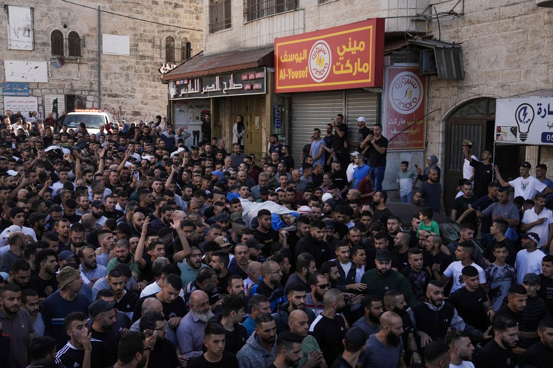 Palestinians carry the bodies of Mohammed Afana and Musa Zaarur, 22, draped in the Islamic Jihad militant group's flag, during their funeral in the West Bank town of Abu Dis, Sunday, Nov. 5, 2023. According to the Palestinian Health Ministry, Zaarur, and Afana, were shot dead during an Israeli arrest raid in Abu Dis, just outside of Jerusalem. (AP Photo/Mahmoud Illean) Palestinians carry the bodies of Mohammed Afana and Musa Zaarur, 22, draped in the Islamic Jihad militant group's flag, during their funeral in the West Bank town of Abu Dis, Sunday, Nov. 5, 2023. According to the Palestinian Health Ministry, Zaarur, and Afana, were shot dead during an Israeli arrest raid in Abu Dis, just outside of Jerusalem. (AP Photo/Mahmoud Illean)