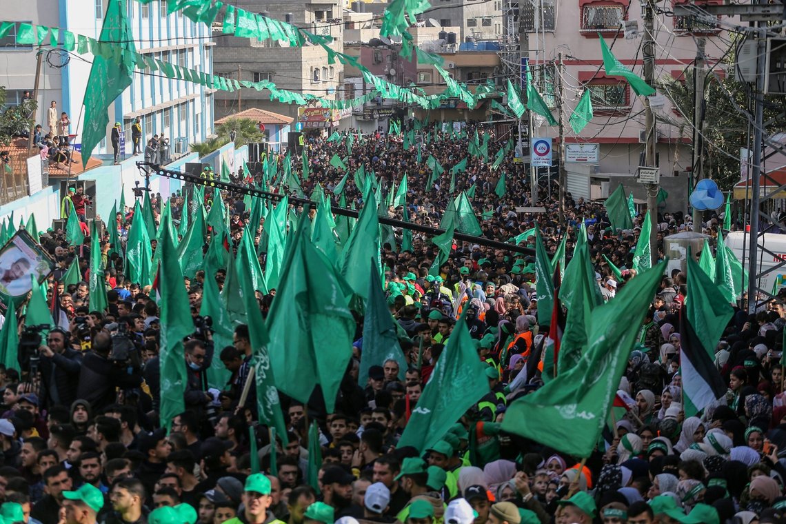 Palestinian Hamas supporters participate in a mass rally marking the 34th anniversary of the founding of the Islamic movement Hamas. In Jabalia refugee camp in the northern Gaza Strip, on Dec10, 2021. Photo: Shutterstock by Anas-Mohammed, Palestine. Palestinian Hamas supporters participate in a mass rally marking the 34th anniversary of the founding of the Islamic movement Hamas. In Jabalia refugee camp in the northern Gaza Strip, on Dec10, 2021. Photo: Shutterstock by Anas-Mohammed, Palestine.