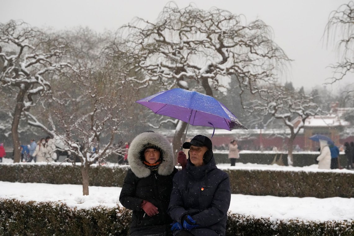 Det er kaldt i Kina. Foto: AP/Ng Han Guan Det er kaldt i Kina. Foto: AP/Ng Han Guan