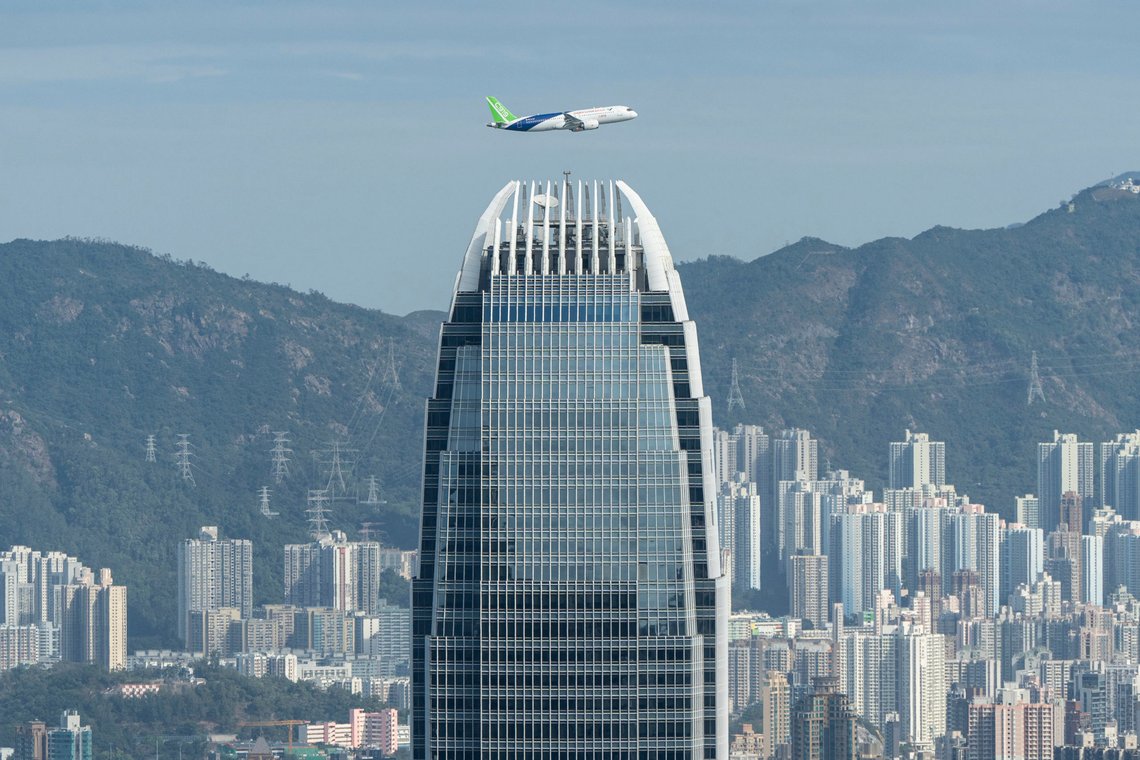 A Chinese-made C919 flies over Hong Kong's Victoria Harbour in Hong Kong on Saturday, Dec. 16, 2023. Chinese aerospace company COMAC has showcased its domestically-developed C919 passenger jet in Hong as it prepares to take on Airbus and Boeing in the market for single-aisle commercial aircraft. (AP Photo/Chan Long Hei) A Chinese-made C919 flies over Hong Kong's Victoria Harbour in Hong Kong on Saturday, Dec. 16, 2023. Chinese aerospace company COMAC has showcased its domestically-developed C919 passenger jet in Hong as it prepares to take on Airbus and Boeing in the market for single-aisle commercial aircraft. (AP Photo/Chan Long Hei)