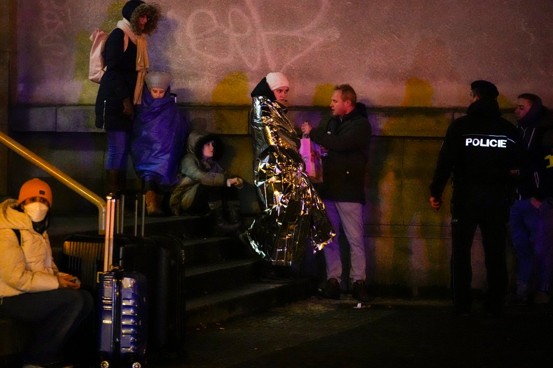 People wait near the building of Philosophical Faculty of Charles University in downtown Prague, Czech Republic, Thursday, Dec. 21, 2023. A mass shooting in downtown Prague killed several people and injured others, and the person who opened fire also is dead, Czech police and the city's rescue service said Thursday. (AP Photo/Petr David Josek) People wait near the building of Philosophical Faculty of Charles University in downtown Prague, Czech Republic, Thursday, Dec. 21, 2023. A mass shooting in downtown Prague killed several people and injured others, and the person who opened fire also is dead, Czech police and the city's rescue service said Thursday. (AP Photo/Petr David Josek)