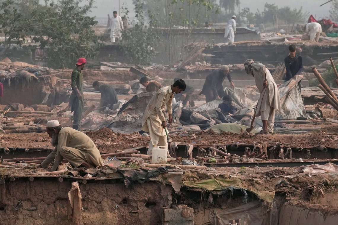 FILE- Afghans retrieve useful items from their damaged mud homes demolished by authorities during a crackdown against an illegal settlement and immigrants, on the outskirts of Islamabad, Pakistan, Wednesday, Nov. 1, 2023. Pakistan’s top court in the capital, Islamabad began hearing Friday, Dec. 1, a petition seeking to halt the deportation of Afghan refugees, officials said, a day after a province in the country's southwest set targets for police to arrest and deport hundreds of thousands of Afghans it says are in the country illegally. (AP Photo/Anjum Naveed, File) FILE- Afghans retrieve useful items from their damaged mud homes demolished by authorities during a crackdown against an illegal settlement and immigrants, on the outskirts of Islamabad, Pakistan, Wednesday, Nov. 1, 2023. Pakistan’s top court in the capital, Islamabad began hearing Friday, Dec. 1, a petition seeking to halt the deportation of Afghan refugees, officials said, a day after a province in the country's southwest set targets for police to arrest and deport hundreds of thousands of Afghans it says are in the country illegally. (AP Photo/Anjum Naveed, File)