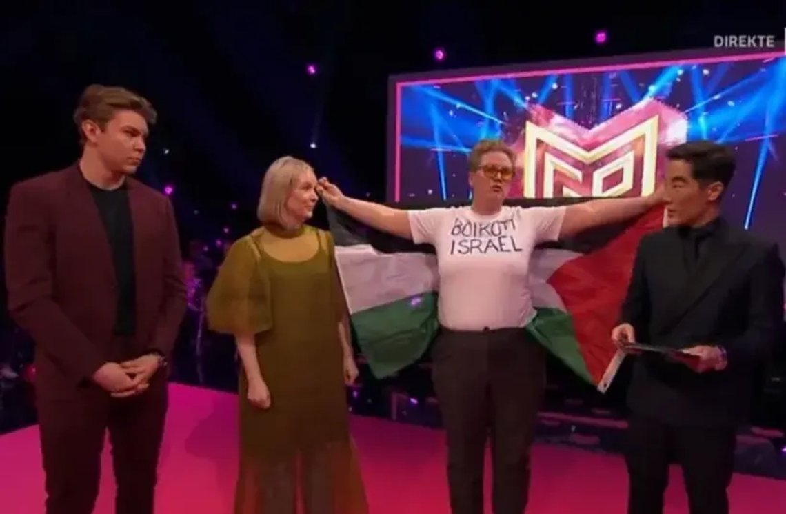 Jerusalem Post: Jorunn Folkvord protesting Israel at the Eurovision semi-finals in Oslo, Norway, January 13, 2023. (photo credit: screenshot) Jerusalem Post: Jorunn Folkvord protesting Israel at the Eurovision semi-finals in Oslo, Norway, January 13, 2023. (photo credit: screenshot)