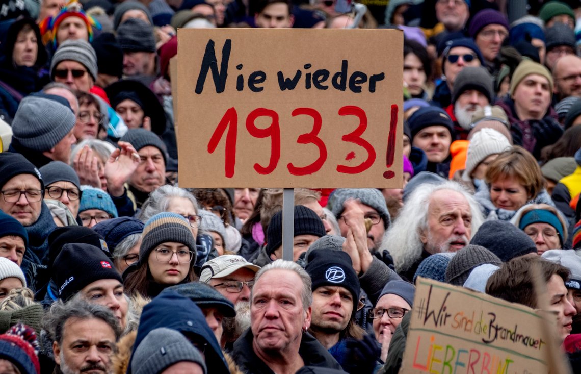 People gather as they protest against the AfD party and right-wing extremism in Frankfurt/Main, Germany, Saturday, Jan. 20, 2024. Sign reads "never again 1933". (AP Photo/Michael Probst) People gather as they protest against the AfD party and right-wing extremism in Frankfurt/Main, Germany, Saturday, Jan. 20, 2024. Sign reads "never again 1933". (AP Photo/Michael Probst)