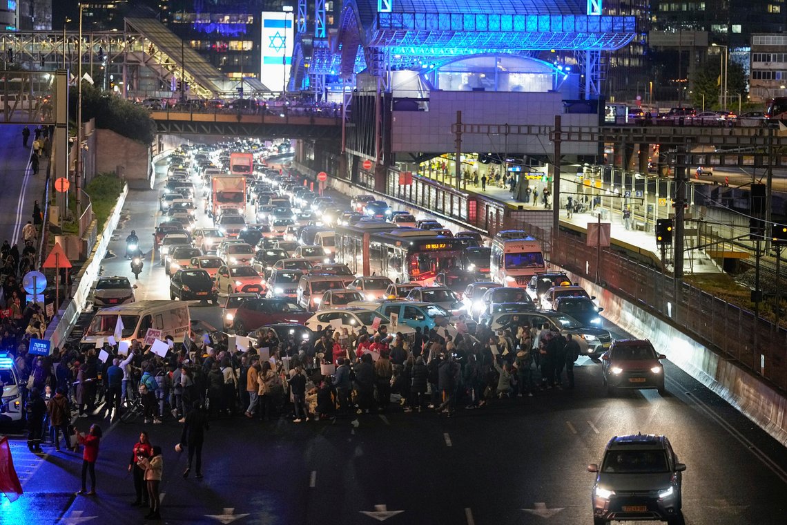 Israeli protesters block a highway during a protest demanding the immediate release of the Israeli hostages held in the Gaza Strip by the Hamas militant group, in Tel Aviv, Israel, Wednesday, Jan. 24, 2024. Israel says Hamas is still holding more than 100 people it captured in an Oct. 7 raid that triggered the current war with Israel. (AP Photo/Ohad Zwigenberg) Israeli protesters block a highway during a protest demanding the immediate release of the Israeli hostages held in the Gaza Strip by the Hamas militant group, in Tel Aviv, Israel, Wednesday, Jan. 24, 2024. Israel says Hamas is still holding more than 100 people it captured in an Oct. 7 raid that triggered the current war with Israel. (AP Photo/Ohad Zwigenberg)
