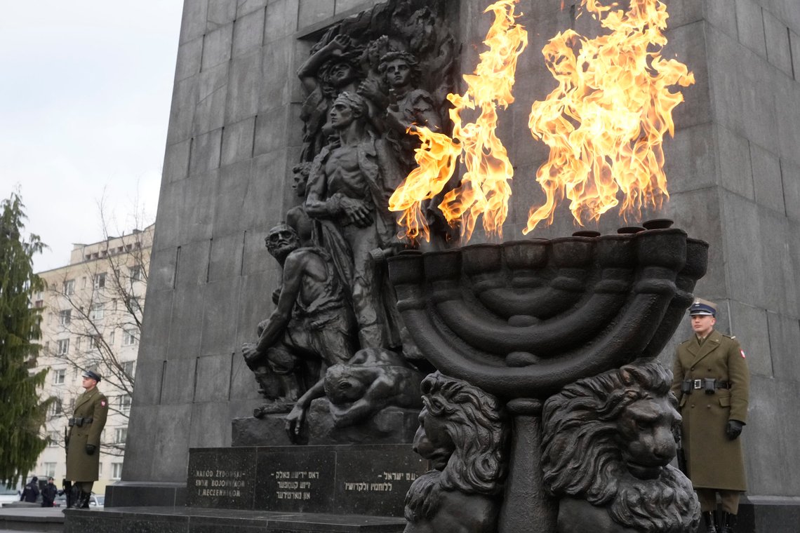 Fire burns in a giant menorah during ceremonies on the eve of the 79th anniversary of the liberation of the Nazi German death camp of Auschwitz-Birkenau by Soviet troops, at the Monument to the Heroes of the Ghetto, in Warsaw, Poland, on Friday, Jan.26, 2024. Main ceremonies with the participation of a handful of survivors are to take place at the Auschwitz-Birkenau memorial place on Saturday, Jan. 27, which is also the International Holocaust Remembrance Day. (AP Photo/Czarek Sokolowski) Fire burns in a giant menorah during ceremonies on the eve of the 79th anniversary of the liberation of the Nazi German death camp of Auschwitz-Birkenau by Soviet troops, at the Monument to the Heroes of the Ghetto, in Warsaw, Poland, on Friday, Jan.26, 2024. Main ceremonies with the participation of a handful of survivors are to take place at the Auschwitz-Birkenau memorial place on Saturday, Jan. 27, which is also the International Holocaust Remembrance Day. (AP Photo/Czarek Sokolowski)