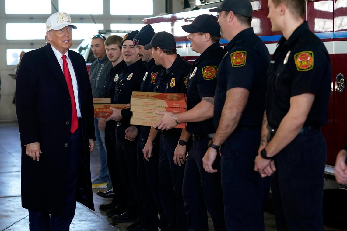 Republican presidential candidate former President Donald Trump delivers pizza to fire fighters at Waukee Fire Department in Waukee, Iowa, Sunday, Jan. 14, 2024. (AP Photo/Andrew Harnik) Republican presidential candidate former President Donald Trump delivers pizza to fire fighters at Waukee Fire Department in Waukee, Iowa, Sunday, Jan. 14, 2024. (AP Photo/Andrew Harnik)