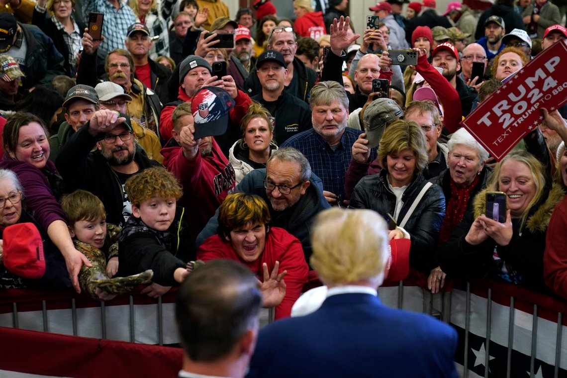 Former President Donald Trump greets supporters during a commit to caucus rally, Friday, Jan. 5, 2024, in Mason City, Iowa. (AP Photo/Charlie Neibergall) Former President Donald Trump greets supporters during a commit to caucus rally, Friday, Jan. 5, 2024, in Mason City, Iowa. (AP Photo/Charlie Neibergall)
