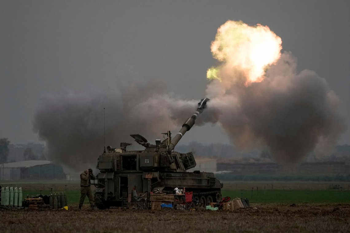 FILE - An Israeli mobile artillery unit fires a shell from southern Israel towards the Gaza Strip, in a position near the Israel-Gaza border on Thursday, Dec. 14, 2023. srael is sending top legal minds, including a Holocaust survivor, to The Hague this week to counter allegations that it is committing genocide against Palestinians in Gaza. (AP Photo/Leo Correa, File) FILE - An Israeli mobile artillery unit fires a shell from southern Israel towards the Gaza Strip, in a position near the Israel-Gaza border on Thursday, Dec. 14, 2023. srael is sending top legal minds, including a Holocaust survivor, to The Hague this week to counter allegations that it is committing genocide against Palestinians in Gaza. (AP Photo/Leo Correa, File)