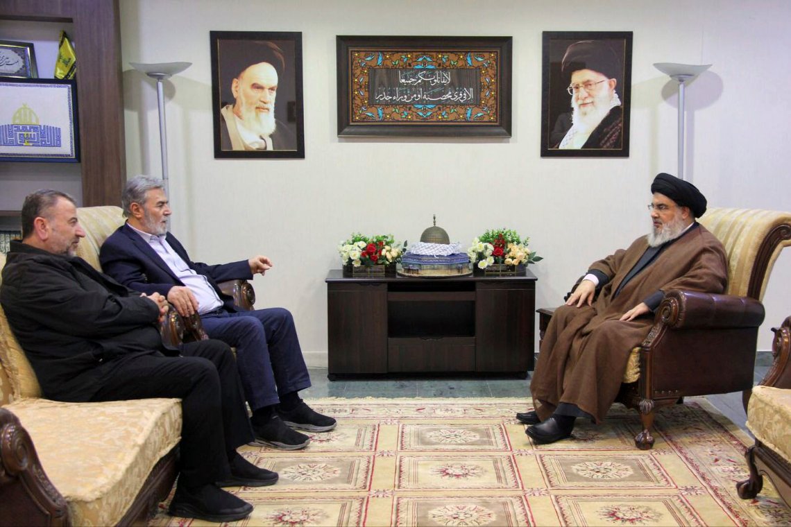 In this photo released on Wednesday, Oct. 25, 2023, by the Hezbollah Media Relations Office, Hezbollah leader Sayyed Hassan Nasrallah, right, meets with Ziad al-Nakhleh, the head of Palestinian Islamic Jihad, center, and Hamas deputy chief, Saleh al-Arouri, in Beirut, Lebanon. Nasrallah met with top Hamas and Palestinian Islamic Jihad officials, their first reported meeting since the Hamas-Israel war erupted earlier this month and clashes began along the Lebanon-Israel border. (Hezbollah Media Relations Office, via AP ) In this photo released on Wednesday, Oct. 25, 2023, by the Hezbollah Media Relations Office, Hezbollah leader Sayyed Hassan Nasrallah, right, meets with Ziad al-Nakhleh, the head of Palestinian Islamic Jihad, center, and Hamas deputy chief, Saleh al-Arouri, in Beirut, Lebanon. Nasrallah met with top Hamas and Palestinian Islamic Jihad officials, their first reported meeting since the Hamas-Israel war erupted earlier this month and clashes began along the Lebanon-Israel border. (Hezbollah Media Relations Office, via AP )