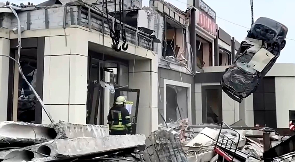 In this photo taken from video released by Russian Emergency Ministry Press Service on Saturday, Feb. 3, 2024, Russian Emergency Ministry employees work at the side of a collapsed bakery after an attack of Ukrainian troops, that Russian officials in Luhansk said was conducted by Ukrainian forces, in Lysychansk, Russian-controlled Luhansk region, eastern Ukraine. According to the Russian Emergency Ministry, five people were found dead under the rubble. Eight people were injured and there might be dozens of civilians under the debris, Moscow-installed authorities said. Search and rescue efforts continue. (Russian Emergency Ministry Press Service via AP) In this photo taken from video released by Russian Emergency Ministry Press Service on Saturday, Feb. 3, 2024, Russian Emergency Ministry employees work at the side of a collapsed bakery after an attack of Ukrainian troops, that Russian officials in Luhansk said was conducted by Ukrainian forces, in Lysychansk, Russian-controlled Luhansk region, eastern Ukraine. According to the Russian Emergency Ministry, five people were found dead under the rubble. Eight people were injured and there might be dozens of civilians under the debris, Moscow-installed authorities said. Search and rescue efforts continue. (Russian Emergency Ministry Press Service via AP)