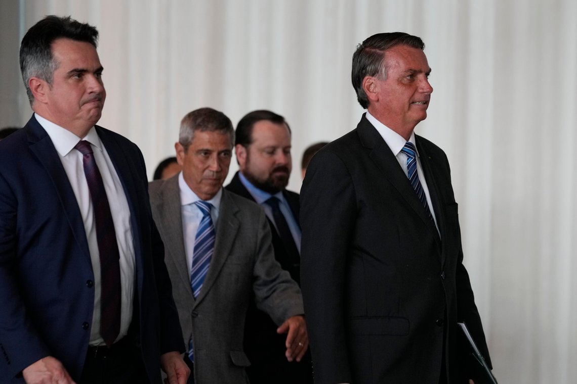 Brazilian President Jair Bolsonaro, right, arrives to speak from his official residence of Alvorada Palace in Brasilia, Brazil, Tuesday, Nov. 1, 2022, the leader's first public comments since losing the Oct. 30 presidential runoff. Behind are Ciro Nogueira, Chief of Staff of the Presidency of Brazil, far left, and Gen. Walter Braga Netto, his running-mate for reelection, second from left. (AP Photo/Eraldo Peres) Brazilian President Jair Bolsonaro, right, arrives to speak from his official residence of Alvorada Palace in Brasilia, Brazil, Tuesday, Nov. 1, 2022, the leader's first public comments since losing the Oct. 30 presidential runoff. Behind are Ciro Nogueira, Chief of Staff of the Presidency of Brazil, far left, and Gen. Walter Braga Netto, his running-mate for reelection, second from left. (AP Photo/Eraldo Peres)