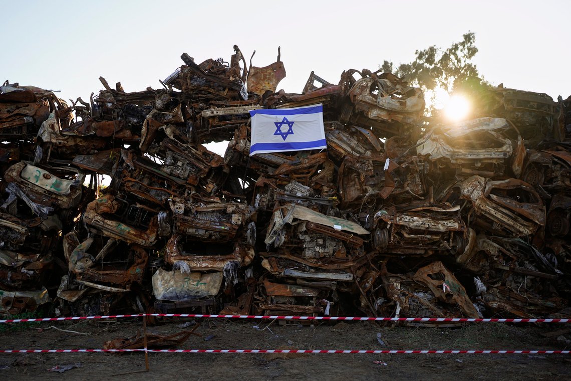 An Israeli flag is placed on a pile of charred vehicles burned in the bloody Oct. 7 cross-border attack by Hamas militants, outside the town of Netivot, southern Israel, Sunday, Jan.7, 2024. (AP Photo/Ohad Zwigenberg) An Israeli flag is placed on a pile of charred vehicles burned in the bloody Oct. 7 cross-border attack by Hamas militants, outside the town of Netivot, southern Israel, Sunday, Jan.7, 2024. (AP Photo/Ohad Zwigenberg)