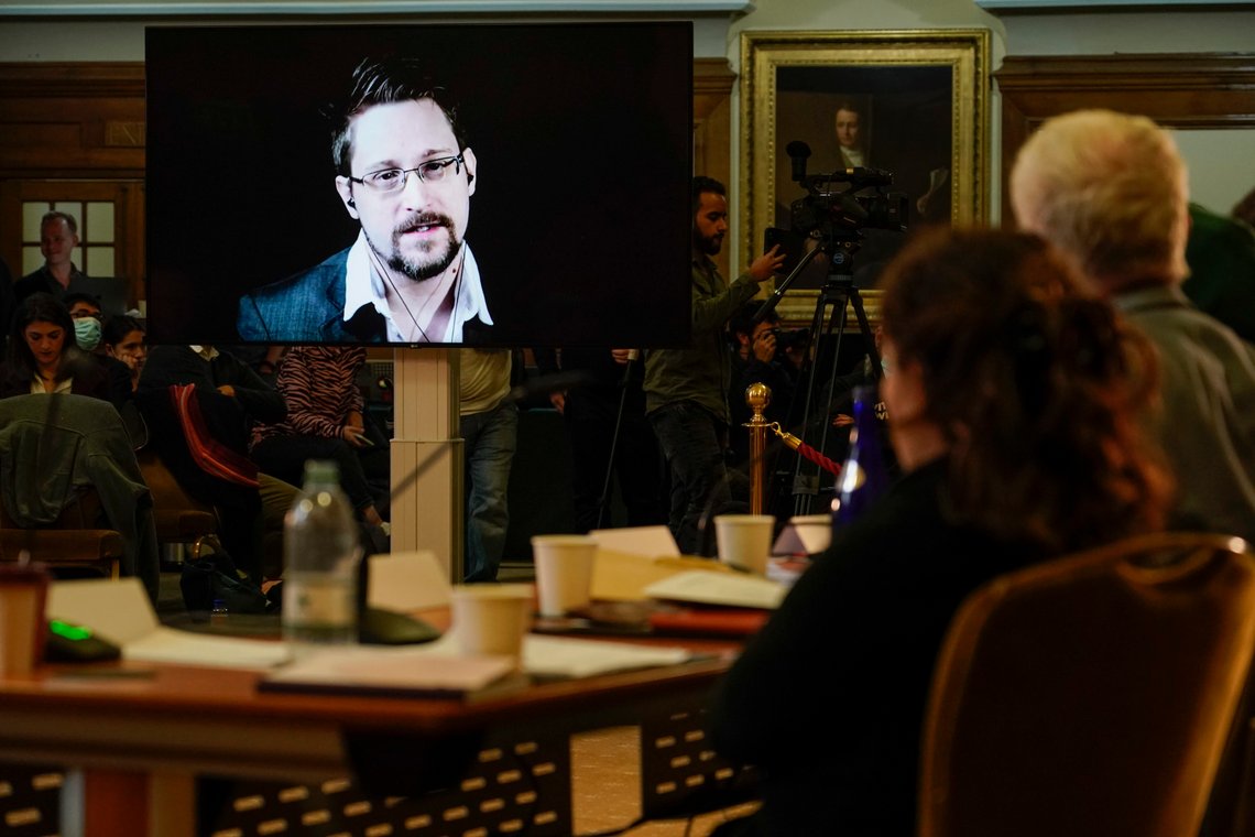 Former computer intelligence consultant Edward Snowden appears virtually, during the 'Belmarsh Tribunal', at Church House in London, Friday, Oct. 22, 2021. Progressive International holds what it calls the 'Belmarsh Tribunal' as it 'turns the tables in the extradition hearing against Julian Assange' on the U.S. The British Government begins its appeal on Wednesday of the High Court decision to block the extradition of the WikiLeaks founder from the UK.(AP Photo/Alberto Pezzali) Former computer intelligence consultant Edward Snowden appears virtually, during the 'Belmarsh Tribunal', at Church House in London, Friday, Oct. 22, 2021. Progressive International holds what it calls the 'Belmarsh Tribunal' as it 'turns the tables in the extradition hearing against Julian Assange' on the U.S. The British Government begins its appeal on Wednesday of the High Court decision to block the extradition of the WikiLeaks founder from the UK.(AP Photo/Alberto Pezzali)