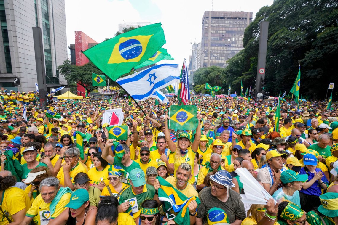 Followers of former Brazilian President Jair Bolsonaro rally to express their support for him in Sao Paulo., Brazil, Sunday, Feb. 25, 2024. Bolsonaro and some of his former top aides are under investigation into allegations they plotted a coup to remove his successor, Luis Inacio Lula da Silva. (AP Photo/Andre Penner) Followers of former Brazilian President Jair Bolsonaro rally to express their support for him in Sao Paulo., Brazil, Sunday, Feb. 25, 2024. Bolsonaro and some of his former top aides are under investigation into allegations they plotted a coup to remove his successor, Luis Inacio Lula da Silva. (AP Photo/Andre Penner)
