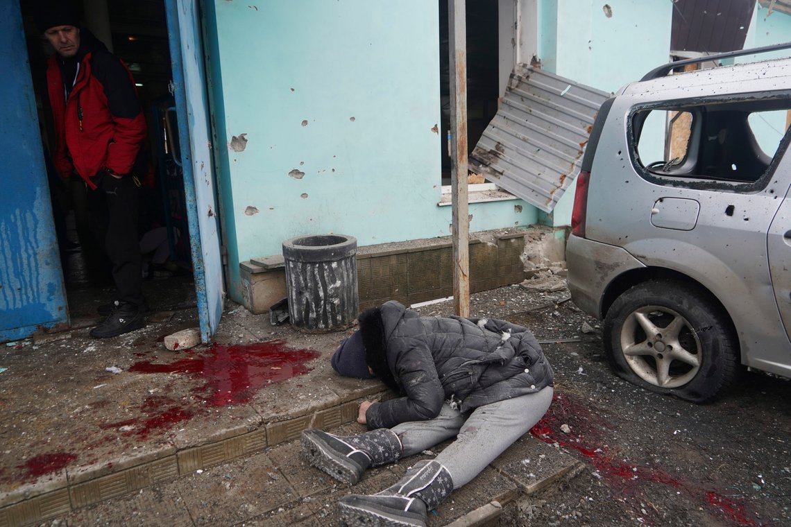 A body of a resident killed in the Russian artillery shelling lies on the ground in the town of Vovchansk, Kharkiv region, Ukraine, five kilometers from the Russian border Tuesday, Feb. 13, 2024. (AP Photo/Andrii Marienko) A body of a resident killed in the Russian artillery shelling lies on the ground in the town of Vovchansk, Kharkiv region, Ukraine, five kilometers from the Russian border Tuesday, Feb. 13, 2024. (AP Photo/Andrii Marienko)