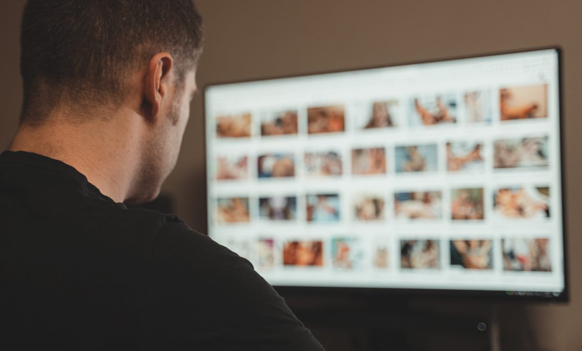 Man browsing porn site late at night. Photo: Shutterstock by M-Production. Man browsing porn site late at night. Photo: Shutterstock by M-Production.