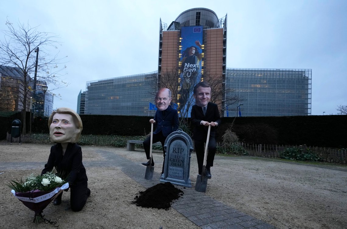 Climate activists pose with masks of EU leaders, from left, European Commission President Ursula von der Leyen, German Chancellor Olaf Scholz and French President Emmanuel Macron during an action in front of EU headquarters in Brussels, Wednesday, Feb. 2, 2022. Climate activists are denouncing today the expected inclusion by the European Commission of nuclear and gas in the list of green energies for investments in the energy sector. (AP Photo/Virginia Mayo) Climate activists pose with masks of EU leaders, from left, European Commission President Ursula von der Leyen, German Chancellor Olaf Scholz and French President Emmanuel Macron during an action in front of EU headquarters in Brussels, Wednesday, Feb. 2, 2022. Climate activists are denouncing today the expected inclusion by the European Commission of nuclear and gas in the list of green energies for investments in the energy sector. (AP Photo/Virginia Mayo)