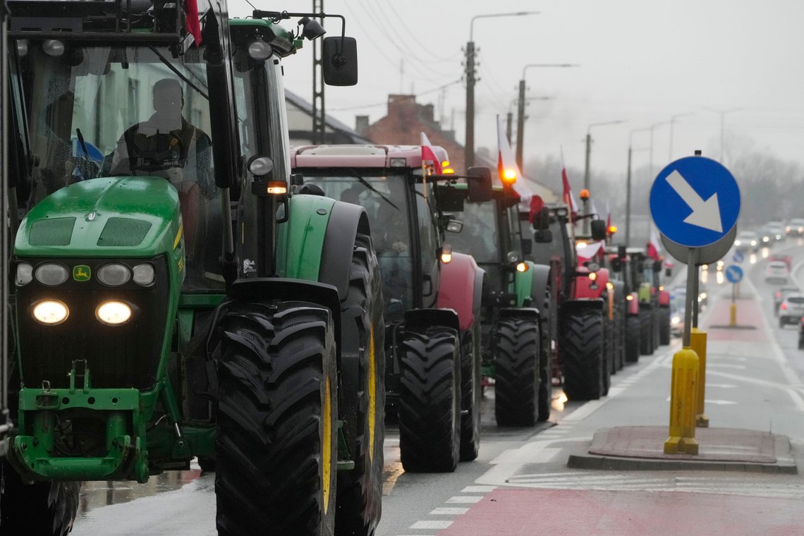Protesting farmers in Poland are slow-driving their tractors on a road in Deblin, Poland, Wednesday, Jan. 24, 2024 to disturb traffic and draw attention to their disagreement to European Union regulations. Such protests were held across Poland. (AP Photo/Czarek Sokolowski) Protesting farmers in Poland are slow-driving their tractors on a road in Deblin, Poland, Wednesday, Jan. 24, 2024 to disturb traffic and draw attention to their disagreement to European Union regulations. Such protests were held across Poland. (AP Photo/Czarek Sokolowski)