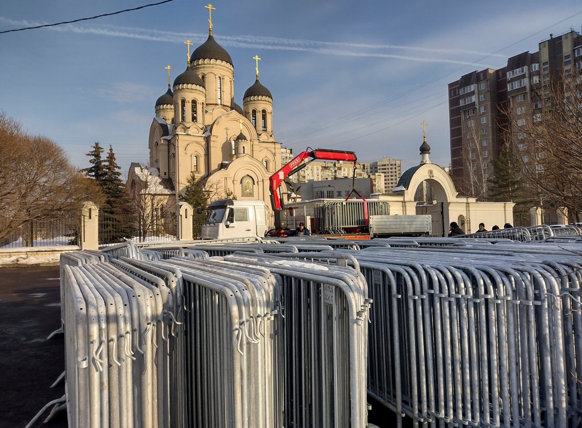 A crane unload police barrier at the Church of the Icon of the Mother of God "Quench My Sorrows", in Moscow, Russia, Thursday, Feb. 29, 2024, prior to the funeral service of Russian opposition leader Alexei Navalny that will be held on Friday, March 1, 2024 The funeral of Russian opposition leader Alexei Navalny, who died earlier this month in a remote Arctic penal colony, will take place on Friday in Moscow after several locations declined to host the service, his spokesperson says. Kira Yarmysh says the funeral will be held at a church in Moscow's southeast Maryino district on Friday afternoon. The burial is to be at a nearby cemetery. (AP Photo) A crane unload police barrier at the Church of the Icon of the Mother of God "Quench My Sorrows", in Moscow, Russia, Thursday, Feb. 29, 2024, prior to the funeral service of Russian opposition leader Alexei Navalny that will be held on Friday, March 1, 2024 The funeral of Russian opposition leader Alexei Navalny, who died earlier this month in a remote Arctic penal colony, will take place on Friday in Moscow after several locations declined to host the service, his spokesperson says. Kira Yarmysh says the funeral will be held at a church in Moscow's southeast Maryino district on Friday afternoon. The burial is to be at a nearby cemetery. (AP Photo)