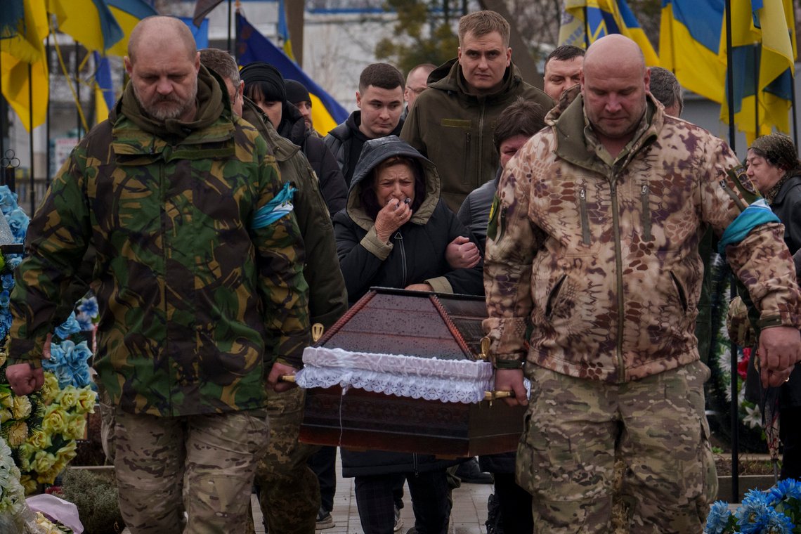 Servicemen carry the coffin of Ukrainian Cpt. Serhii Vatsko followed by his mother Oksana Vatsko in Boiarka, Ukraine, Friday, March 29, 2024. Vatsko, who was killed on the frontline of eastern Ukraine on March 24 joined the country's military in 2014. (AP Photo/Vadim Ghirda) Servicemen carry the coffin of Ukrainian Cpt. Serhii Vatsko followed by his mother Oksana Vatsko in Boiarka, Ukraine, Friday, March 29, 2024. Vatsko, who was killed on the frontline of eastern Ukraine on March 24 joined the country's military in 2014. (AP Photo/Vadim Ghirda)