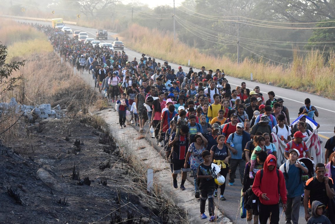 FILE - Migrants walk along the highway through Arriaga, Chiapas state in southern Mexico, Monday, Jan. 8, 2024, during their journey north toward the U.S. border. In Senegal's capital, Nicaragua is a hot ticket among travel agents serving people who want to live in the United States. Many migrants take various flights to eventually arrive there legally and then journey illegally by land to the U.S. border with Mexico. The sudden draw of the United States seems driven in large part by social media posts by those who reached their destinations successfully and travel agents who know visa rules. (AP Photo/Edgar H. Clemente, File) FILE - Migrants walk along the highway through Arriaga, Chiapas state in southern Mexico, Monday, Jan. 8, 2024, during their journey north toward the U.S. border. In Senegal's capital, Nicaragua is a hot ticket among travel agents serving people who want to live in the United States. Many migrants take various flights to eventually arrive there legally and then journey illegally by land to the U.S. border with Mexico. The sudden draw of the United States seems driven in large part by social media posts by those who reached their destinations successfully and travel agents who know visa rules. (AP Photo/Edgar H. Clemente, File)