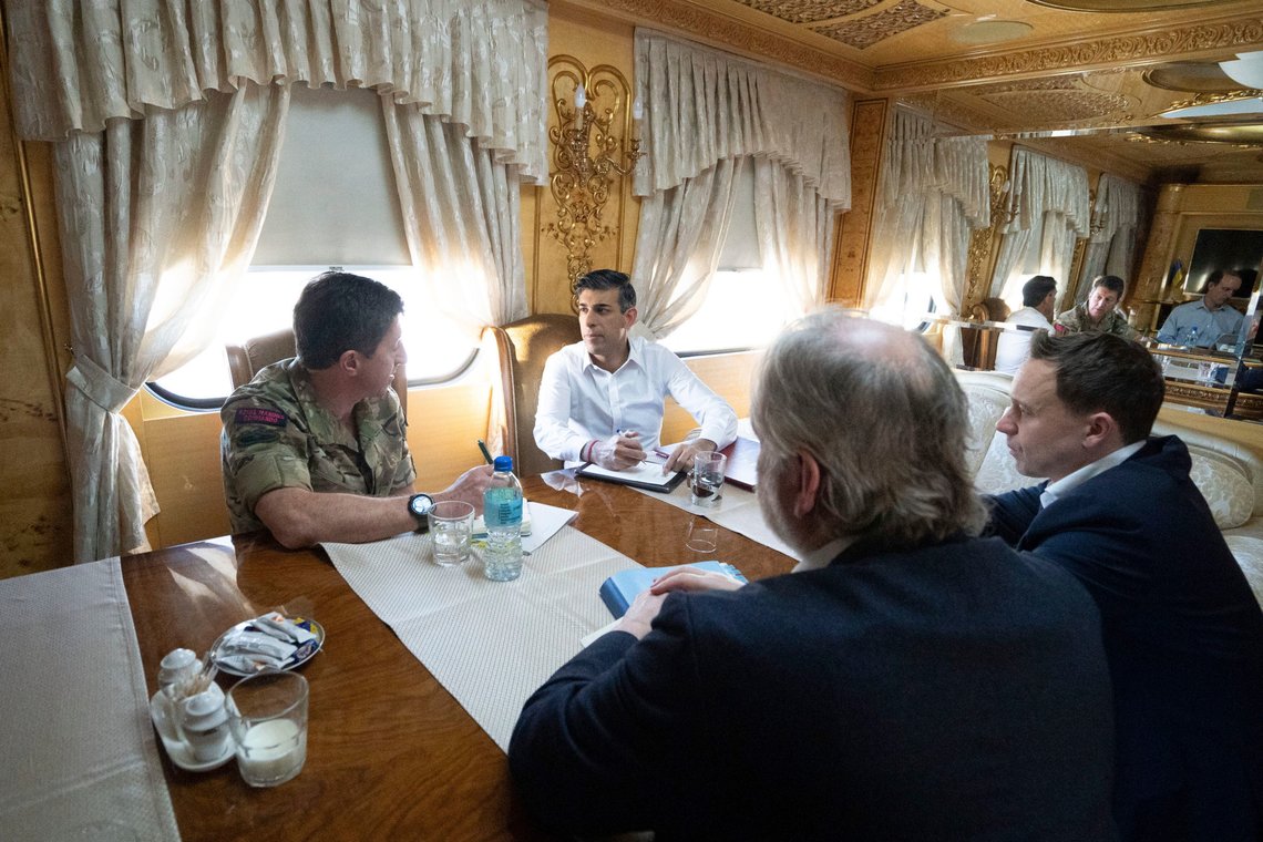 Britain's Prime Minister Rishi Sunak, top right, speaks with Vice Chief of the Defence Staff Major General Gwyn Jenkins, left, on a train travelling through Ukraine as he heads to meet with President Volodymyr Zelensky after announcing a major new package of £2.5 billion in military aid to the country over the coming year, near Kyiv, Ukraine, Friday Jan. 12, 2024. (Stefan Rousseau/Pool via AP) Britain's Prime Minister Rishi Sunak, top right, speaks with Vice Chief of the Defence Staff Major General Gwyn Jenkins, left, on a train travelling through Ukraine as he heads to meet with President Volodymyr Zelensky after announcing a major new package of £2.5 billion in military aid to the country over the coming year, near Kyiv, Ukraine, Friday Jan. 12, 2024. (Stefan Rousseau/Pool via AP)
