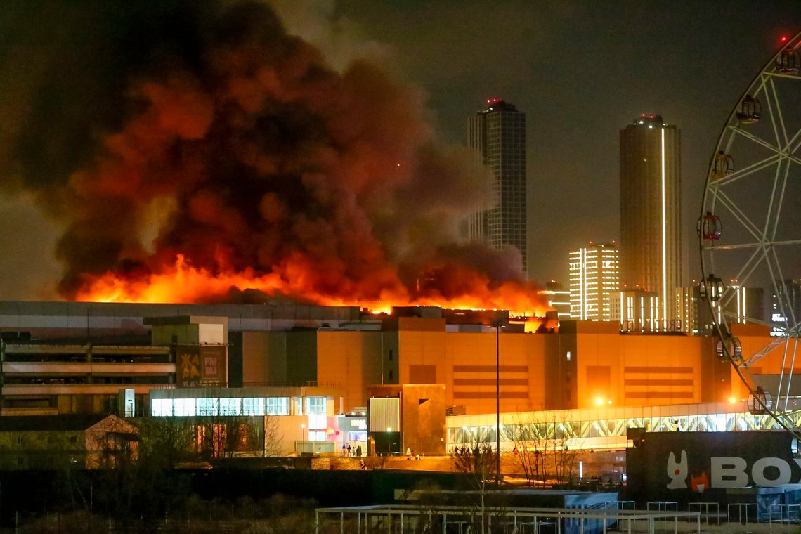 A massive blaze is seen over the Crocus City Hall on the western edge of Moscow, Russia, Friday, March 22, 2024. Several gunmen have burst into a big concert hall in Moscow and fired automatic weapons at the crowd, injuring an unspecified number of people and setting a massive blaze in an apparent terror attack days after President Vladimir Putin cemented his grip on the country in a highly orchestrated electoral landslide. (Sergei Vedyashkin/Moscow News Agency via AP) A massive blaze is seen over the Crocus City Hall on the western edge of Moscow, Russia, Friday, March 22, 2024. Several gunmen have burst into a big concert hall in Moscow and fired automatic weapons at the crowd, injuring an unspecified number of people and setting a massive blaze in an apparent terror attack days after President Vladimir Putin cemented his grip on the country in a highly orchestrated electoral landslide. (Sergei Vedyashkin/Moscow News Agency via AP)